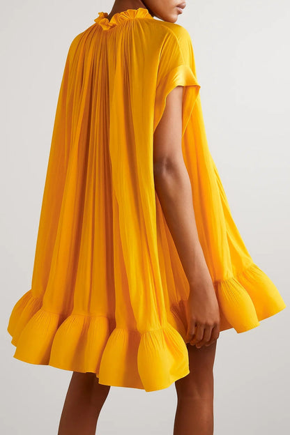 Kort geplisseerd jurkje | Wijd en zwierig | Saffraangeel