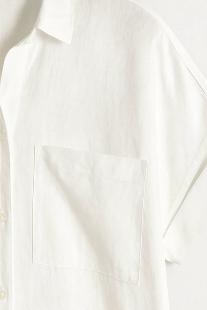 Lange blouse met borstzakken en omgeslagen mouwen